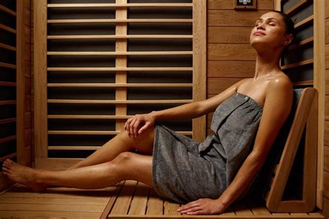 The brunette does the handjob in the sauna .